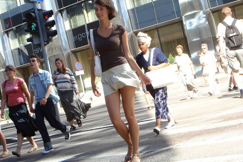 Brown-haired woman in a white mini skirt
