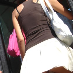 Brown-haired woman in a white mini skirt 3