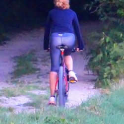 A girl in the forest on a bicycle 6
