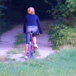 A girl in the forest on a bicycle 5
