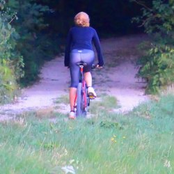 A girl in the forest on a bicycle 4